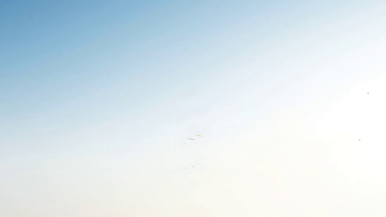 {  "description": "Beneath a pristine blue sky, a...